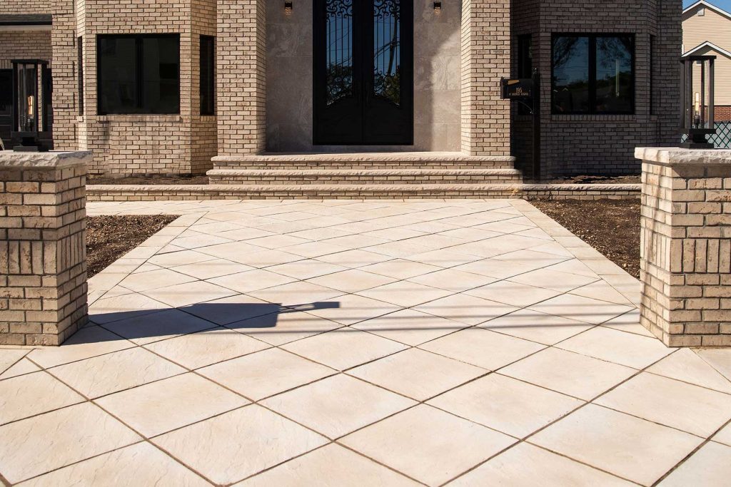 Natural Cleft Flagstone pairs textured surfaces with defined edges, giving this patio traditional stone character within an organized layout.