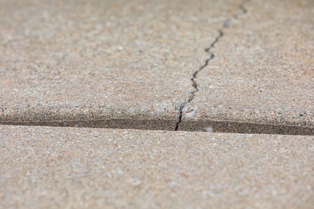Why Outdoor Surfaces Crack and Shift Over Time
